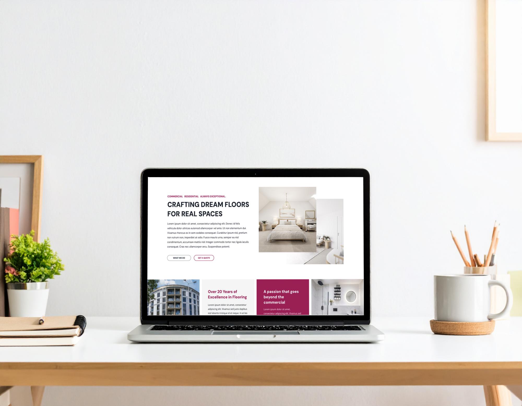 Laptop displaying a bespoke website for a flooring company, featuring bedroom imagery and project information.