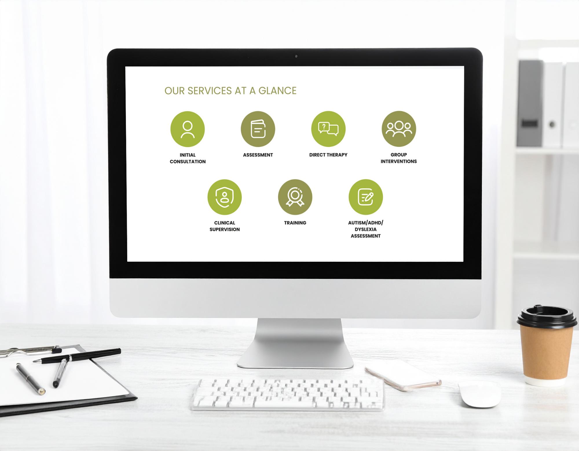 Desktop computer displaying a services overview with seven green circular icons for consultation, assessment, therapy, group interventions, supervision, training and dyslexia assessment.